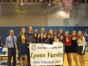 ZONI Vice President Kevin Helmick presents the Lyons Township varsity team with their 2012 Sportsmanship Banner